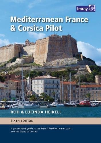 Book cover: coastal town with fortress, boats, and title "Mediterranean France & Corsica Pilot".