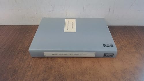 A light blue slipcase book titled Bricks and Mortar on a wooden surface.