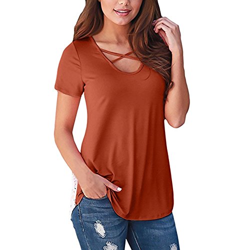 Woman wearing a rust-colored, short-sleeved top and denim jeans.