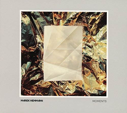 The image shows a CD cover with a white envelope on crumpled foil. For accessibility purposes, a suitable alt text could be: "CD cover with white envelope on crumpled gold foil background."