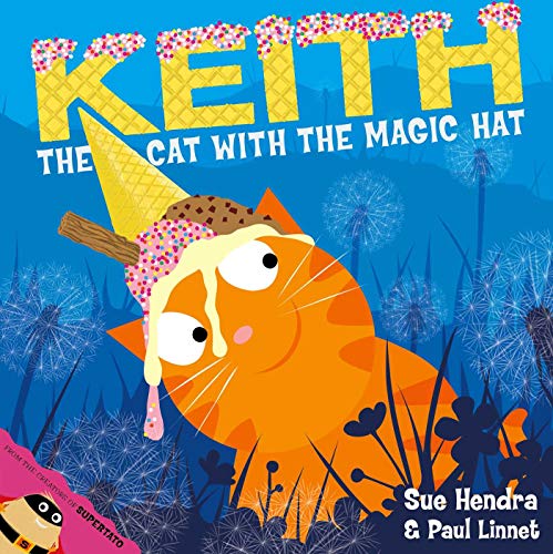 An orange cat wearing an ice cream cone hat in a field of dandelions.