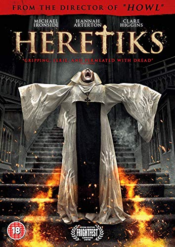 DVD cover for "Heretiks" featuring a figure in a white robe on burning steps.