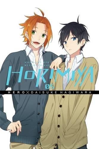 Manga cover featuring two young men with orange and black hair in cardigans.