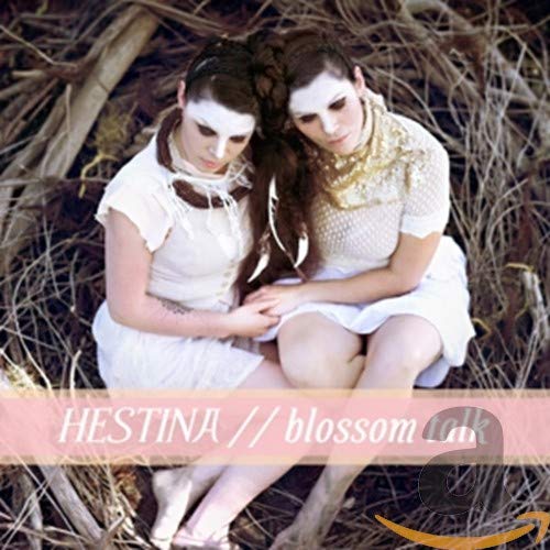 CD cover: Two pale women in white dresses among tree roots.