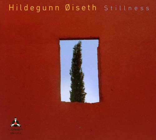 Red CD cover with a window framing a tall, dark green tree.
