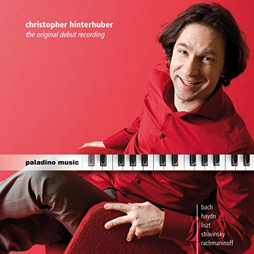 CD cover featuring pianist Christopher Hinterhuber in red, with piano keys.