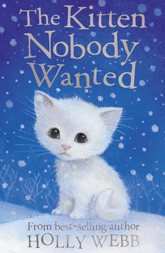 A fluffy white kitten sits in the snow against a blue, snowy background.