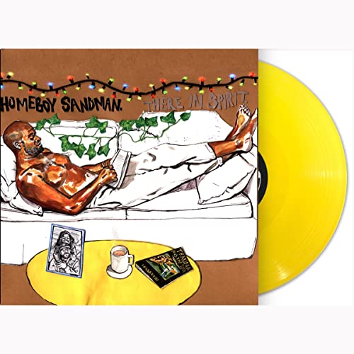 Yellow vinyl record with illustrated cover of a man reading on a couch.