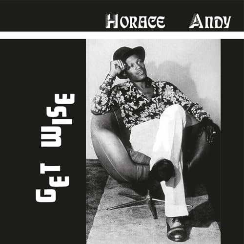 Horace Andy album cover: man in hat seated in armchair.