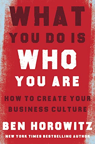 Red book cover with bold white text: "What You Do Is Who You Are".
