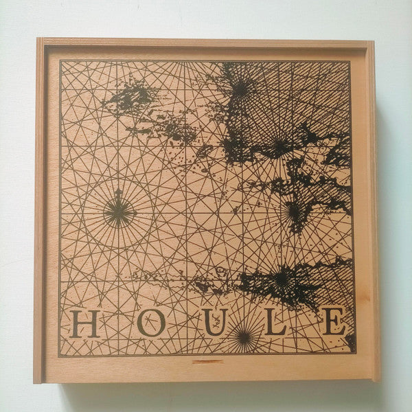 Vinyl record in a wooden frame with abstract geometric design and text.