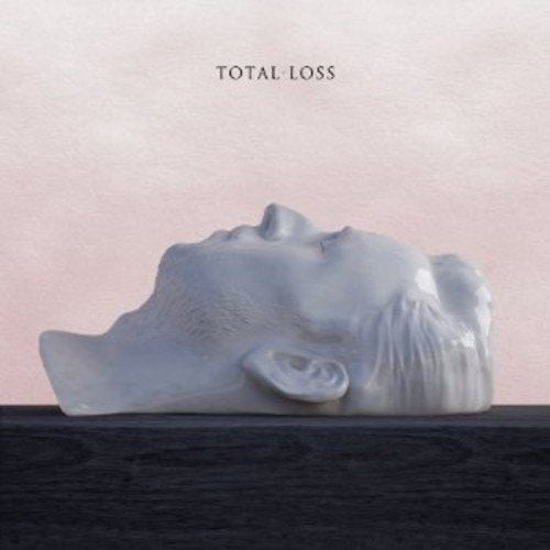 Album cover for “Total Loss” featuring a white sculpted face.