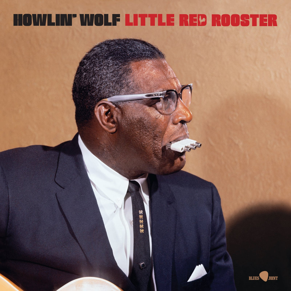 Howlin' Wolf album cover featuring a portrait of the blues musician with a harmonica.