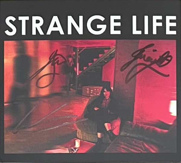 CD cover for Howling Bells’ “Strange Life” album, signed in silver.