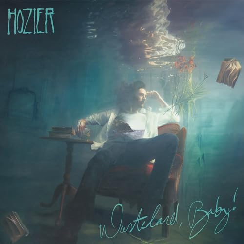 Hozier album cover: man seated in a room with smoke and flowers.