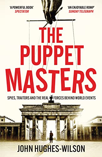 Book cover: "The Puppet Masters" with a hand manipulating strings over Brandenburg Gate.