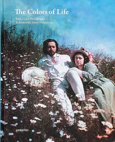 A man and woman sit together in a field of wildflowers on this book cover.