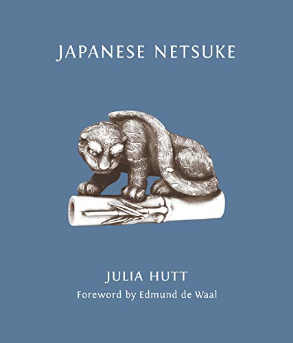 Book cover featuring a detailed, carved netsuke of a coiled badger.