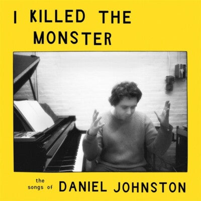 Yellow vinyl cover with black-and-white photo of a person at a piano.