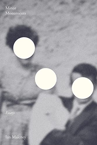 Book cover with blurred vintage photograph and white circles.