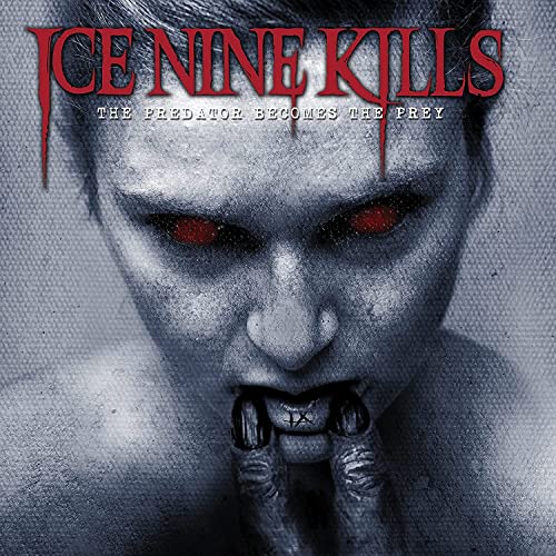 Album cover: close-up of a monstrous face with red eyes and fangs.