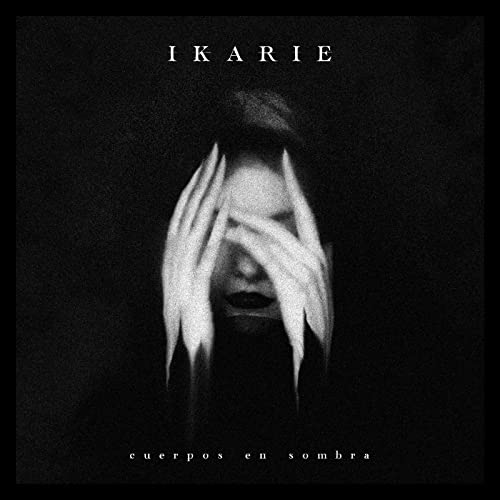 Dark album cover featuring a face partially obscured by white strands.