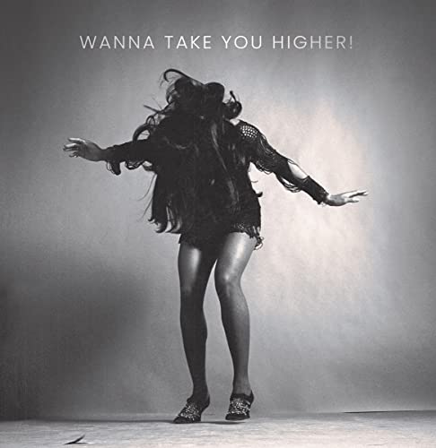 Black and white album cover featuring Tina Turner in a dynamic pose.