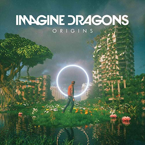 Imagine Dragons “Origins” album cover: man in a surreal, overgrown landscape.