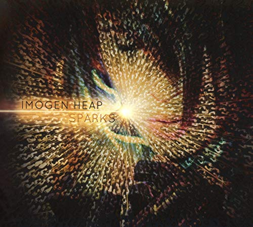 Imogen Heap’s “Sparks” CD cover: abstract golden sparks radiating from a face.