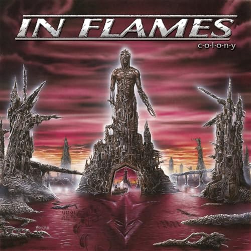 In Flames “Colony” album cover: a figure atop a gothic cityscape.