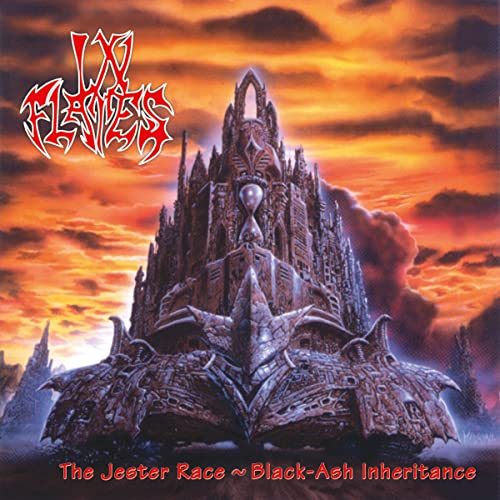 Album cover art featuring a large, ornate stone structure against a fiery sunset sky.