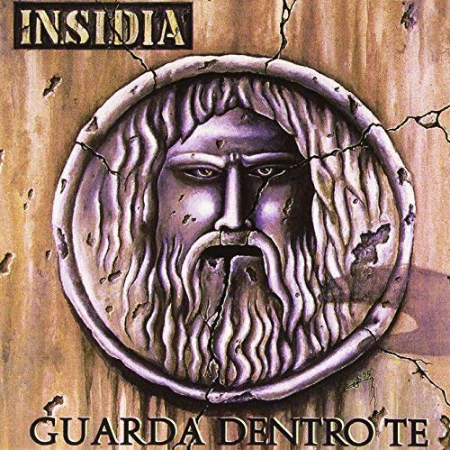 Vinyl album cover featuring a bearded face within a cracked circle.