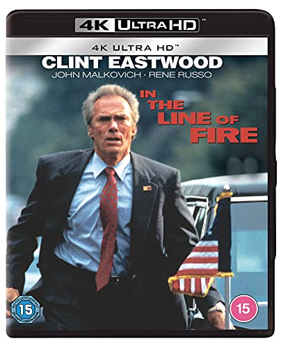 Clint Eastwood in a suit next to an American flag on a 4K disc cover.
