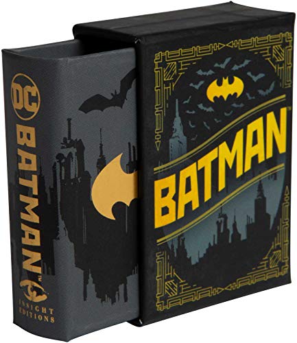 Small, dark blue Batman book with bat symbol and city skyline.