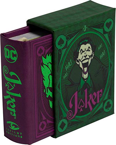 A small purple Joker book partially slid out of a green decorative slipcase.