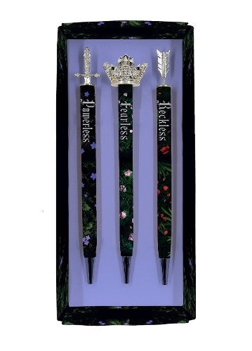 Three decorated pens in a gift box, each topped with a different emblem.