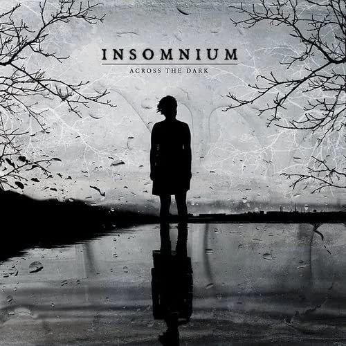 Insomnium album cover: lone figure reflected in dark, misty water.