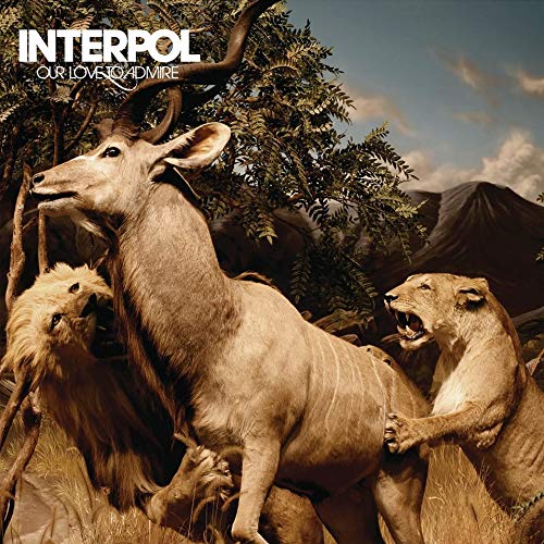 "Album cover with antelope being attacked by two lions, trees and mountains in background."