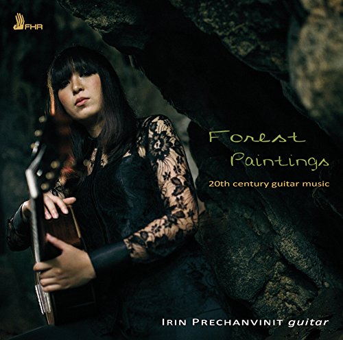 "CD cover featuring a woman holding a guitar in a dark, rocky setting."