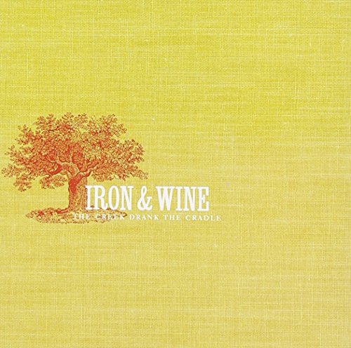 Yellow CD cover with an orange tree and “Iron & Wine” text.