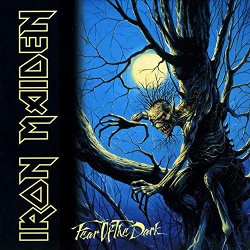Iron Maiden “Fear Of The Dark” album cover with a monstrous figure in trees.