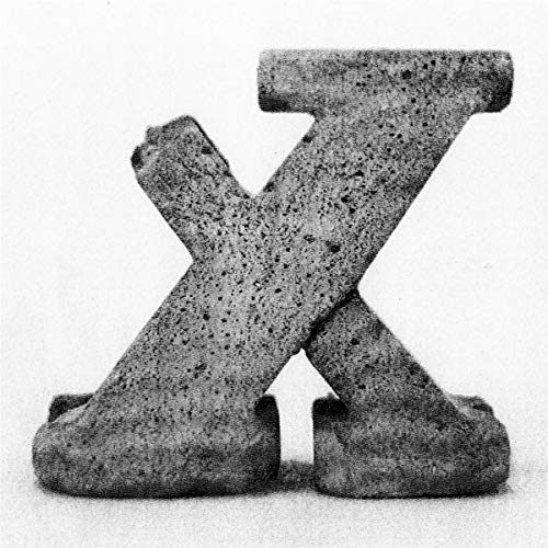 Black and white album cover featuring a textured, abstract "X" shape.