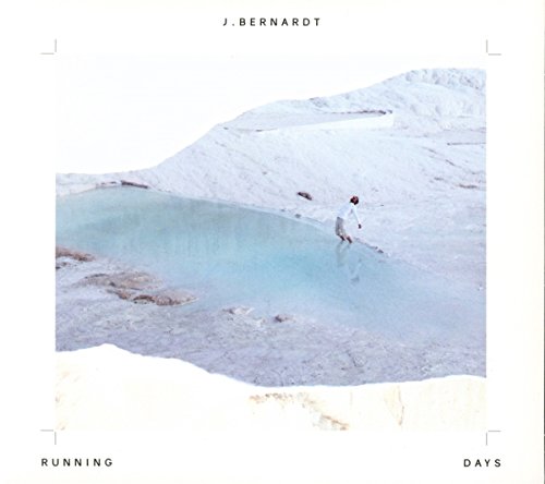 CD cover for J. Bernardt’s “Running Days” featuring a person running on white terrain.