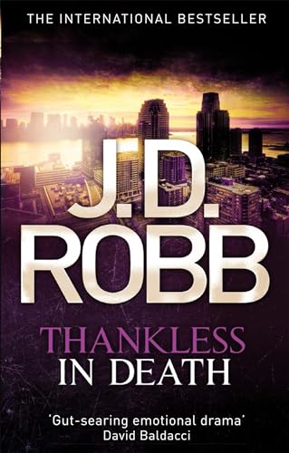 Book cover: "Thankless in Death" by J.D. Robb, with a city skyline.