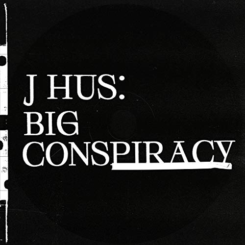 Black vinyl record with white text: “J HUS: BIG CONSPIRACY”.