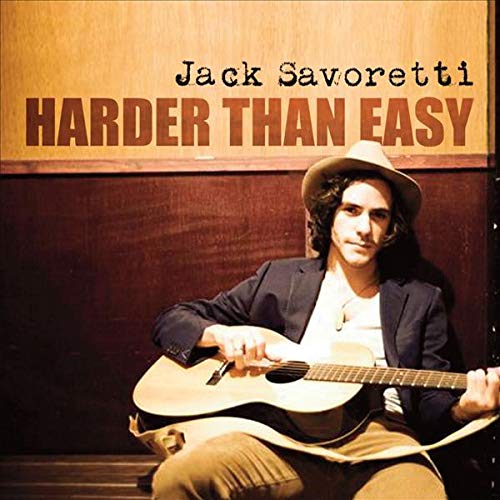 Jack Savoretti album cover with artist holding a guitar, wearing a hat.