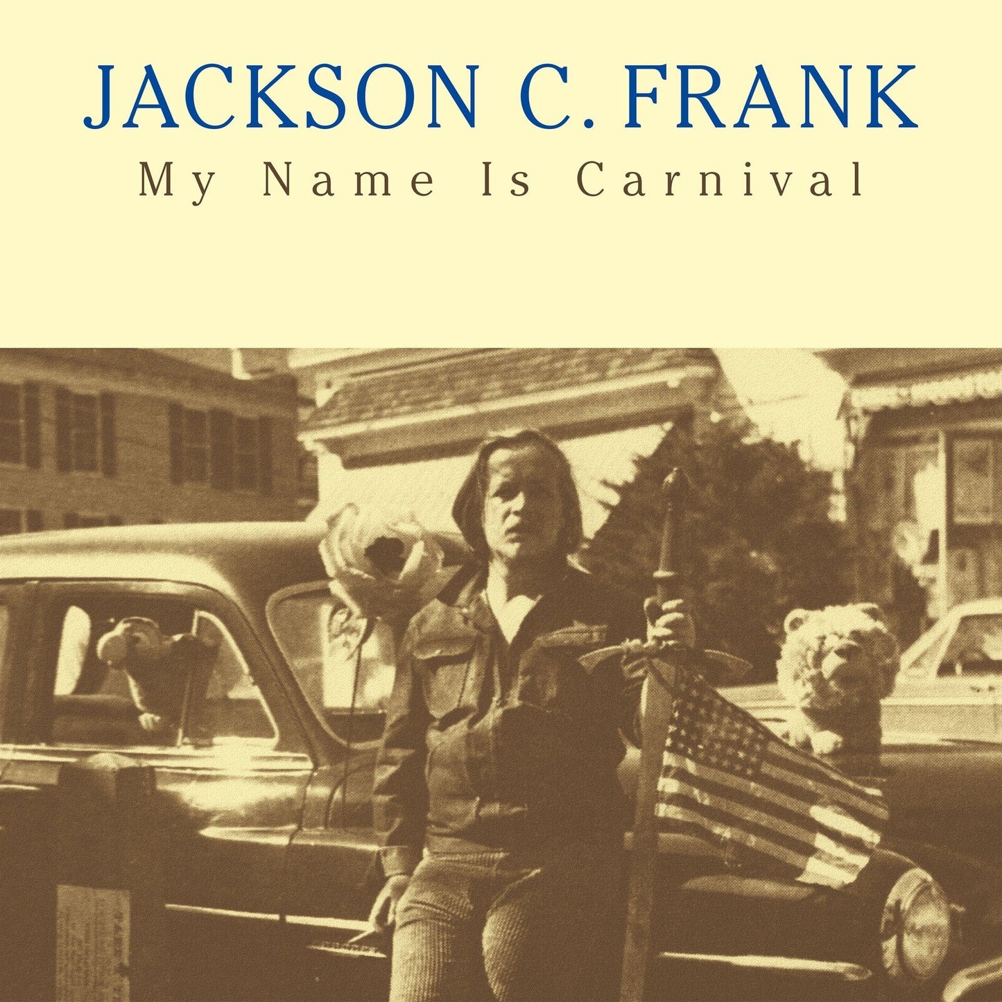 Sepia-toned album cover featuring a person with teddy bears near a car.