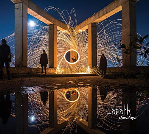 Night scene with figures, sparks, concrete structure, and a moonlit reflection.