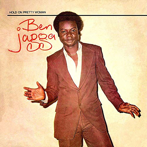 Album cover featuring a man in a brown suit, gesturing with outstretched arms.