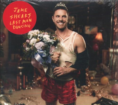 Jake Shears album cover featuring a smiling man holding flowers.